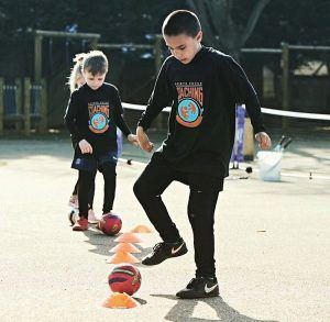 children playing football at a Sports Focus UK camp